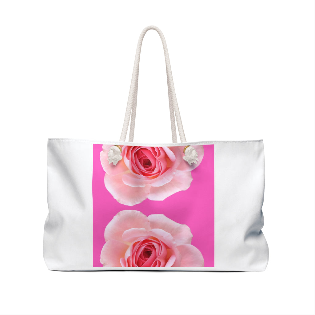 Back view of moontiq 'rose and sorbet' white tote bag with vertical pink rose design and white rope handles against a white background