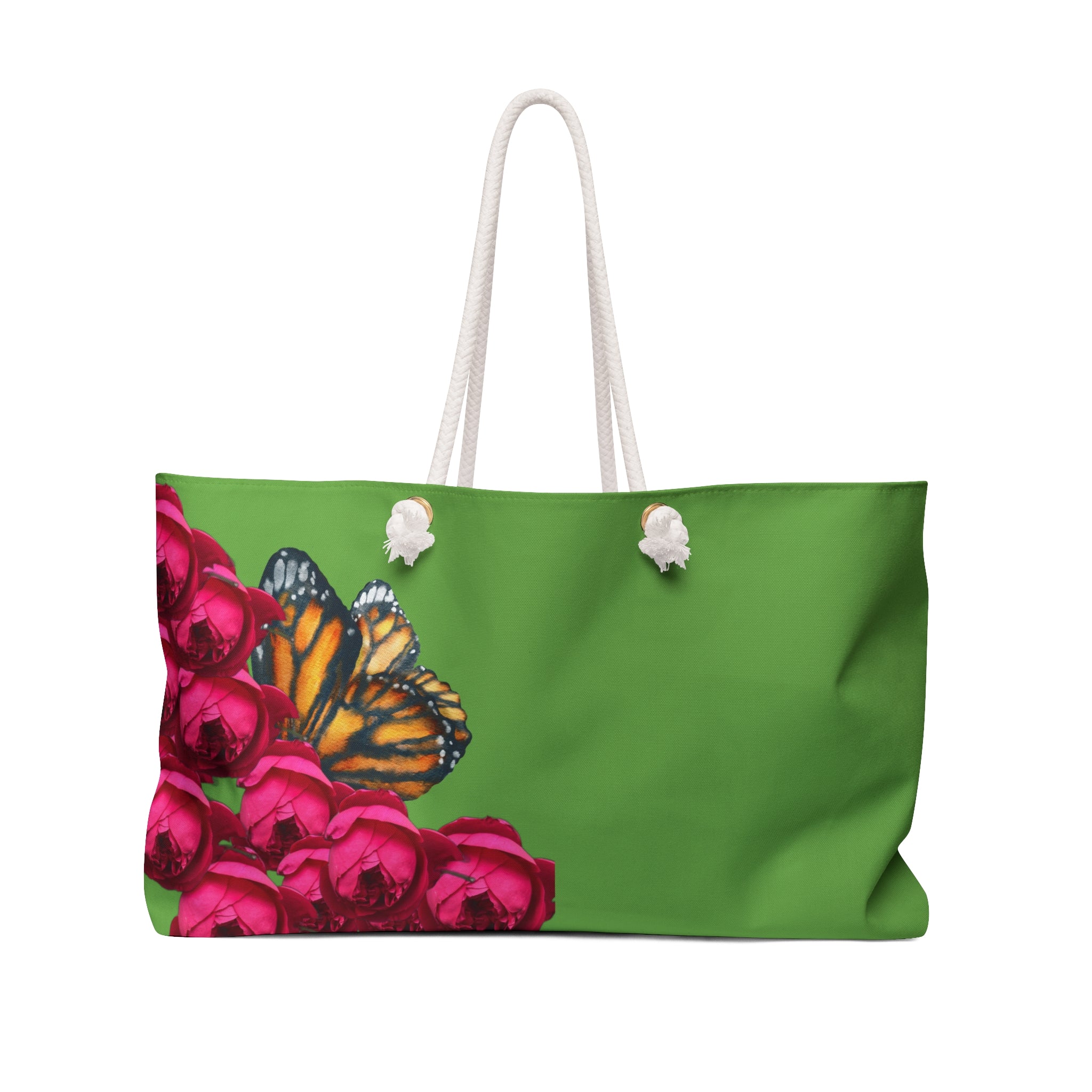 Green tote bag with a butterfly and pink flowers design on a green background and white rope handles.