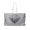 moontiq 'I Got Wings' large heavenly gray tote bag with an angel wing design with white rope handles on a white background