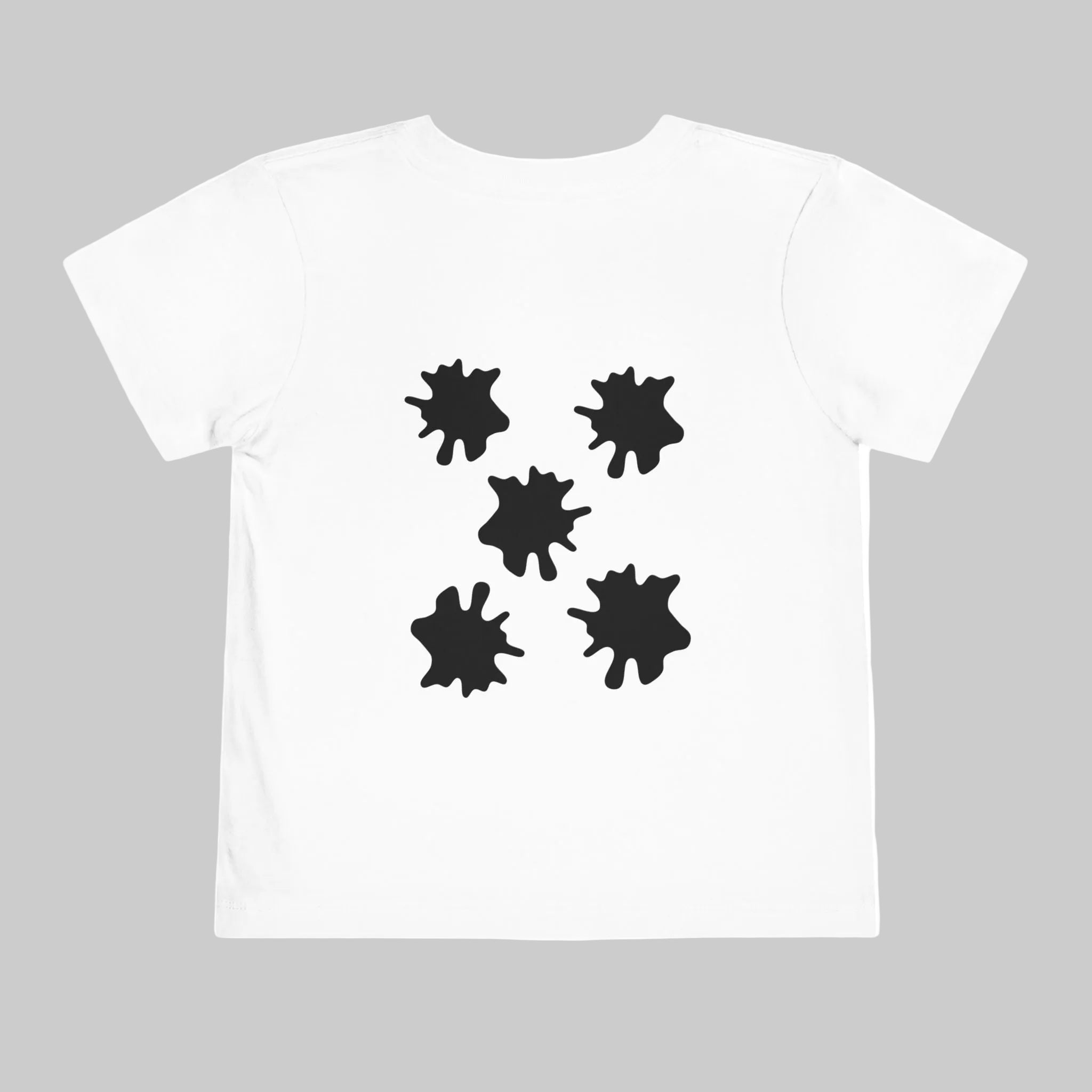 White t-shirt with irregularly shaped black ladybug spots on a white background. The irregular ladybug spots symbolise someone who is different. How can we stop bullying? By celebrating people's differences. This moontiq t-shirt design celebrates individual differences.